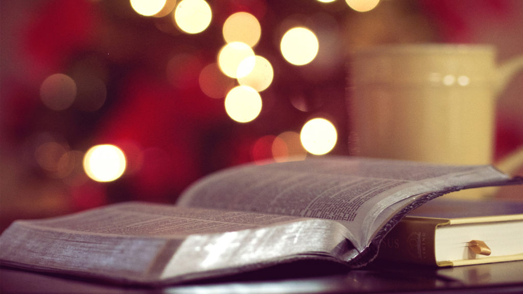 bokeh-photography-of-book-page-near-yellow-ceramic-mug